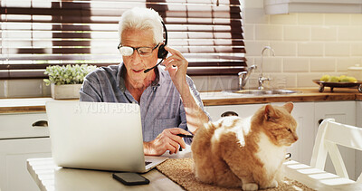 Buy stock photo Mature man, headset and laptop at house for customer service, online advice and helping client. Male person, remote work and consultation on PC with cat, FAQ and CRM assistance for solution feedback