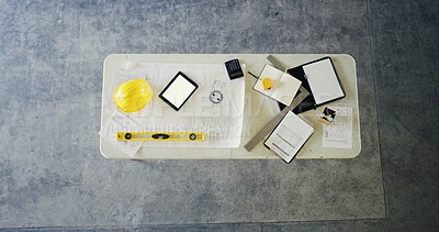 Buy stock photo Above, construction and equipment in worksite with PPE, worker set up or display for gear inspection. Compliance, layout and contractor on desk with prep station, blueprint or tool in safety check.