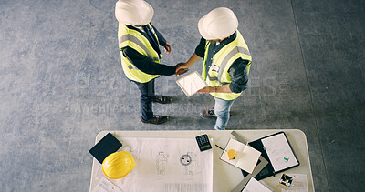 Buy stock photo Above, construction worker or people with handshake for deal, agreement or mockup space. Top view, architect or team shaking hands for collaboration, development or safety approval with tablet screen