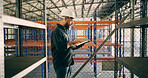 Inspection, schedule and tablet with construction worker man in warehouse for agenda or checklist. App, industry and planning with person in storage depot for maintenance, management or manufacturing