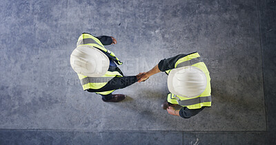 Buy stock photo Above, engineer and people with handshake for construction deal, agreement or space. Top view, architect and team shaking hands for collaboration, building development and safety approval at site
