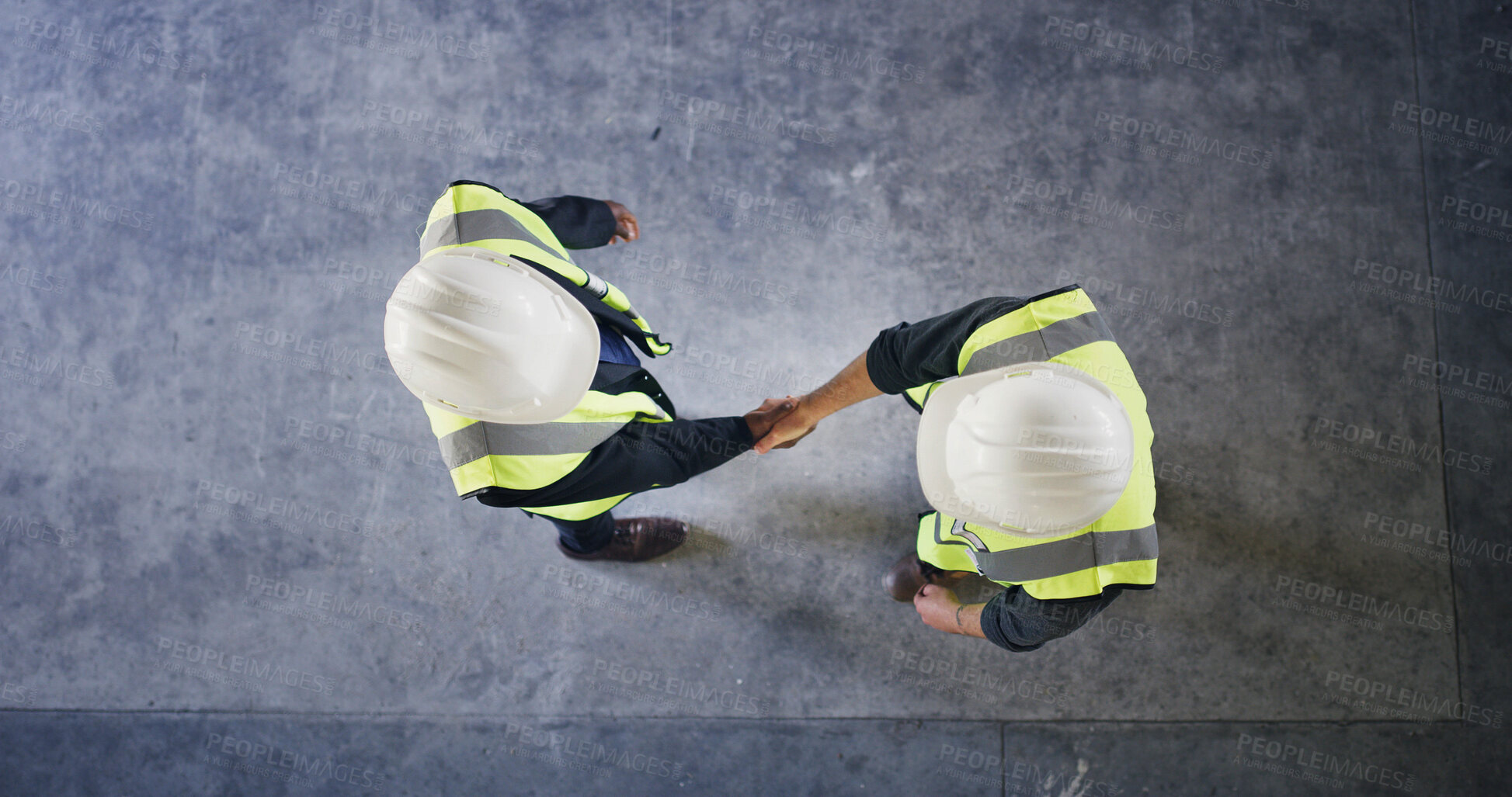Buy stock photo Above, engineer and people with handshake for construction deal, agreement or space. Top view, architect and team shaking hands for collaboration, building development and safety approval at site