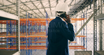Buy stock photo Man, phone call and talk at storage plant, inspection and report with back at industrial warehouse. Person, smartphone and feedback with contact, discussion or review for supply chain management