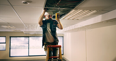 Buy stock photo Electrician, man and test cable with multimeter for maintenance, voltage or fix energy system. Electricity, wire and worker repair ceiling for power, measure current or office inspection with ladder