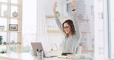 Buy stock photo Hands raised, laptop and success with business woman at desk in office for celebration of goals or target. Cheering, computer and smile with happy employee in workplace for achievement or milestone