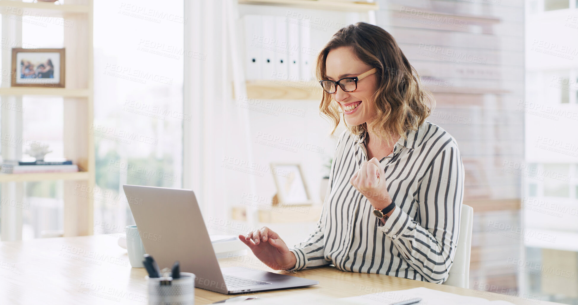Buy stock photo Fist pump, laptop and smile with business woman at desk in office for celebration of goals or target. Computer, success and winner with happy employee in workplace for achievement or milestone