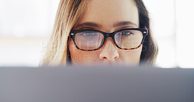 Buy stock photo Woman, glasses and reading on computer at house for research, editor feedback and proofreading. Female person, journalist and pc to review article, fact check and story report for project publication