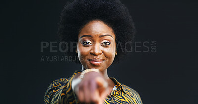 Buy stock photo Portrait, black woman and pointing at you in studio for choice, selection or winner. Smile, decision and African person with finger gesture for vote, support or encourage on dark background space