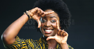 Buy stock photo Portrait, black woman and finger frame in studio with smile for profile picture on dark background. Female person, African model and perspective for photography, creative inspiration or hand sign