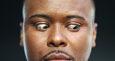 Buy stock photo Nervous, anxiety and eyes of black man in studio for stress, fear and paranoid for mental health risk. Horror, terror and nightmare with person with schizophrenia on dark background for danger