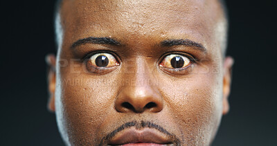 Buy stock photo Shock, anxiety and portrait with eyes of black man in studio for stress, fear and paranoid for mental health risk. Horror, terror and nightmare with person with schizophrenia on dark background