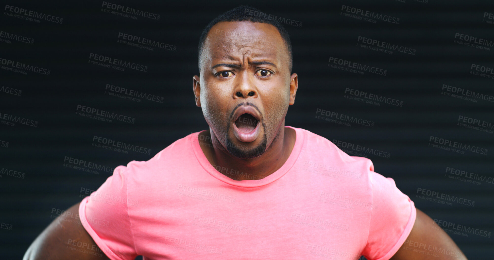 Buy stock photo Portrait, shock and African man in studio with dark background, intense and surprise at sale. Reaction, close up and male model on set with black backdrop, confusion and amazed at discount price.