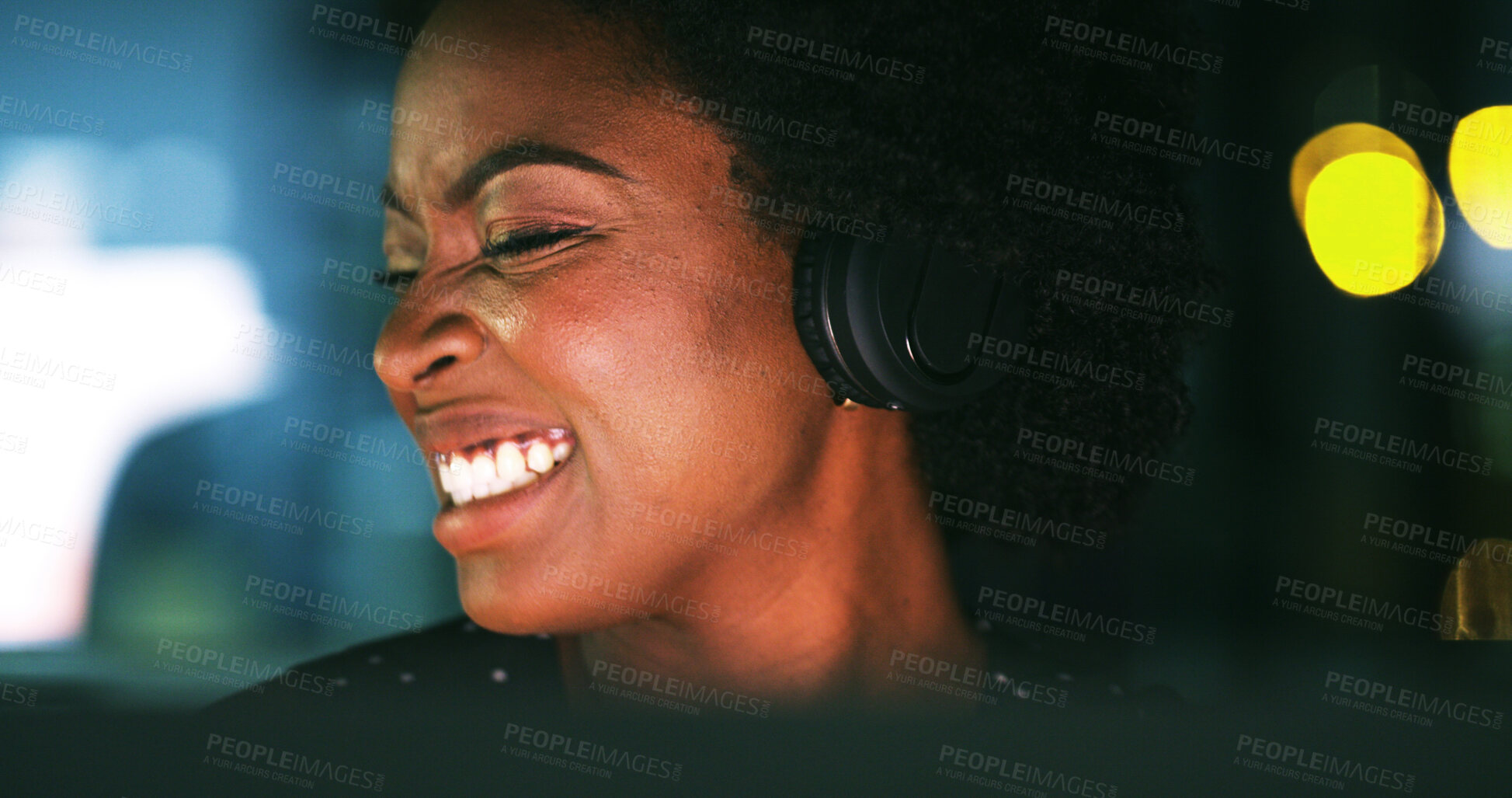 Buy stock photo Woman, headphones and music at night in office with bokeh, streaming or computer at media company. African person, happy and inspiration at startup, overtime and audio subscription at creative agency