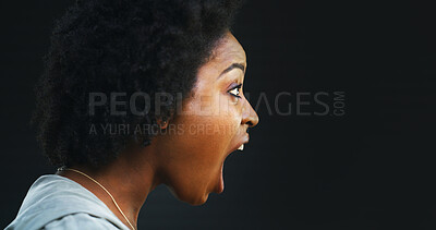 Buy stock photo Angry, scream and profile of black woman with shout, yelling or frustrated in studio. Crisis, stress and person voice anger with rage, anxiety and annoyed with mockup space on dark background
