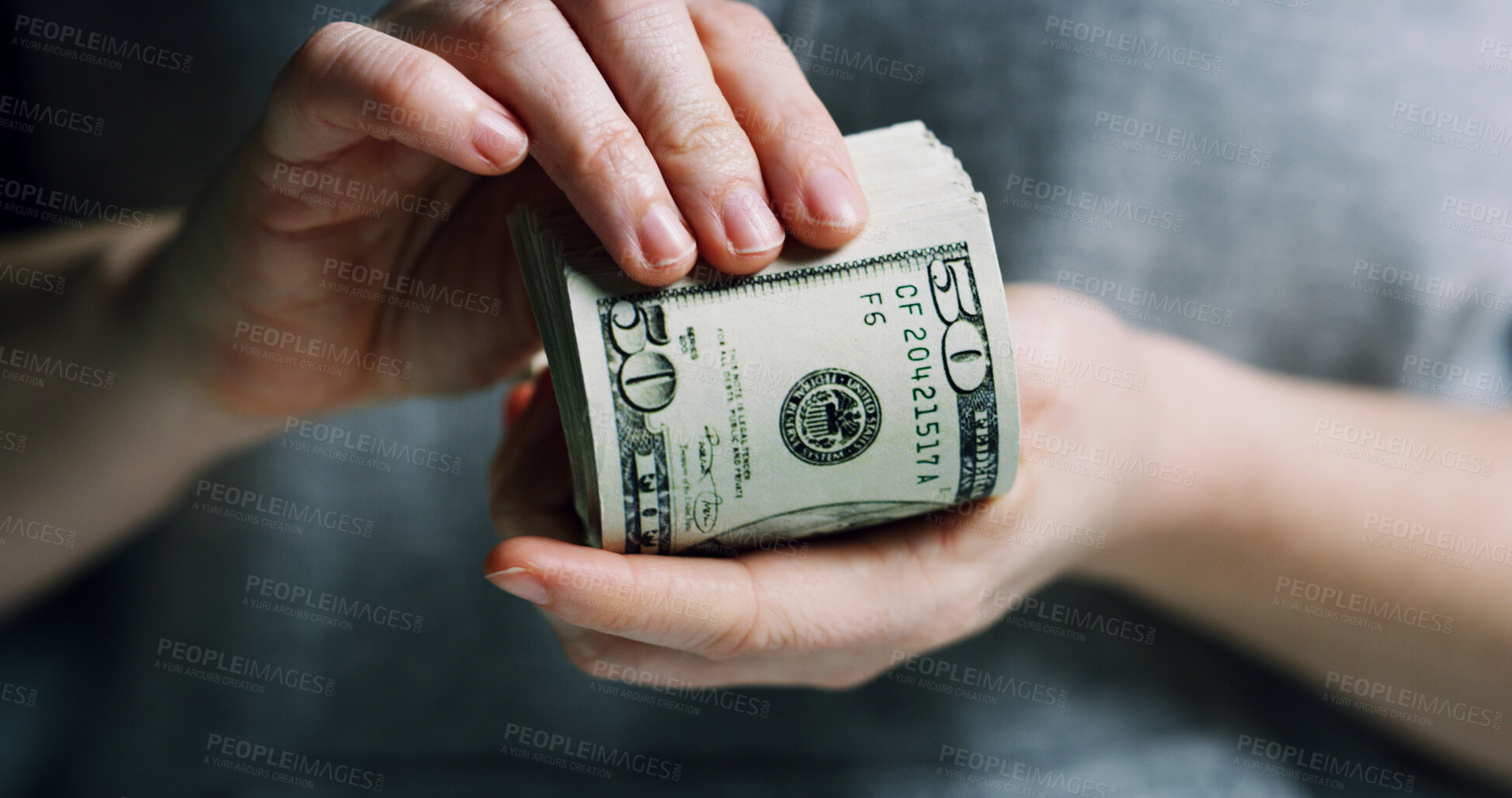 Buy stock photo Hands, person and stack of dollars for fraud crime, money laundering and smuggling cash. Criminal, wages and notes of wealth from finance scam, illegal profit and corruption income with currency