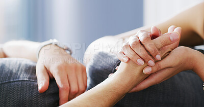 Buy stock photo Couple, holding hands and understanding in home, love and compassion for partner, marriage and care. Relationship, comfort and people with commitment, sympathy and support for spouse in living room