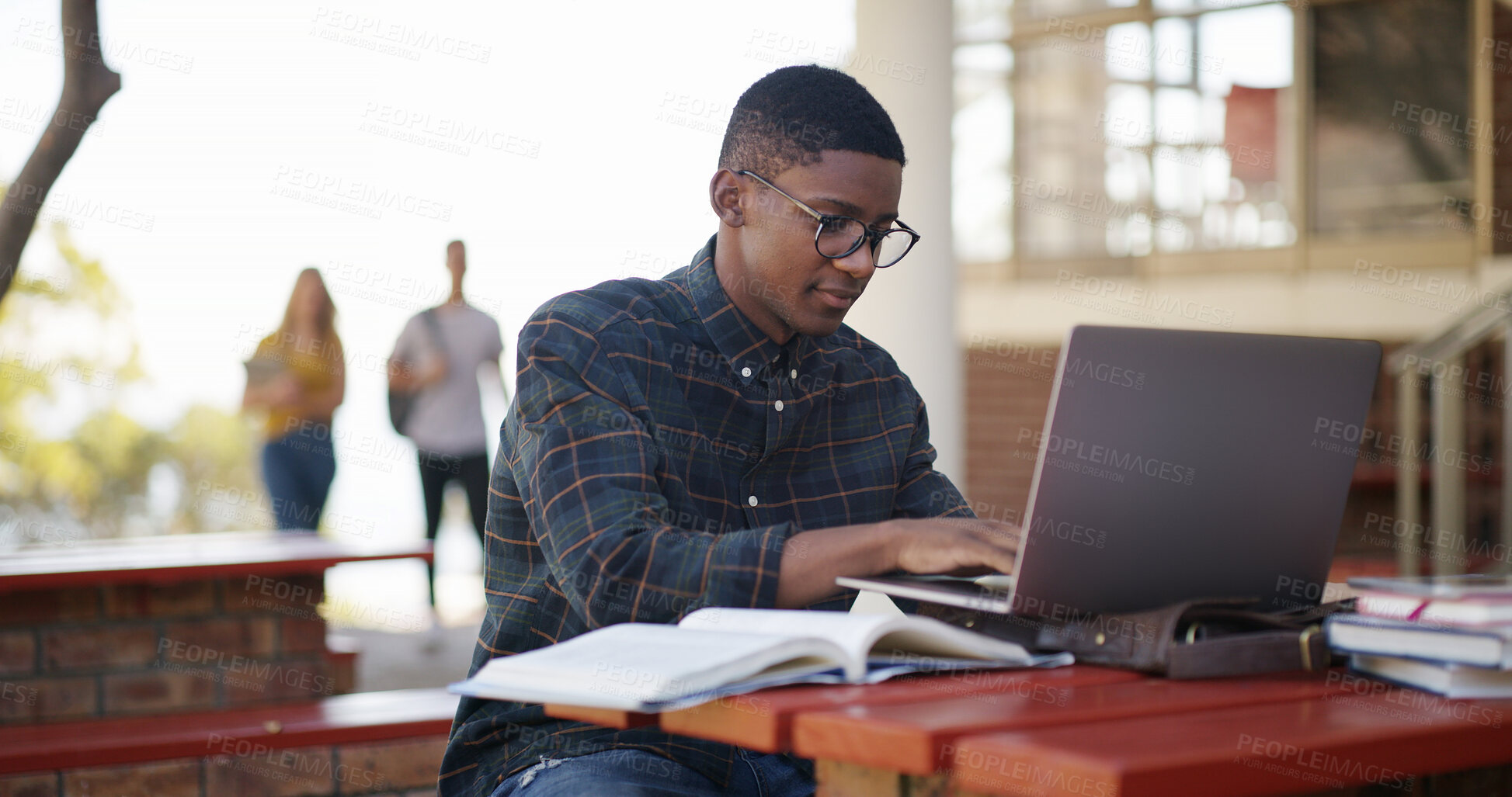 Buy stock photo Student, typing and man in campus with laptop, test and research for project deadline. Preparation, multitask and scholar with study material, brainstorm and problem solve for academic goals.