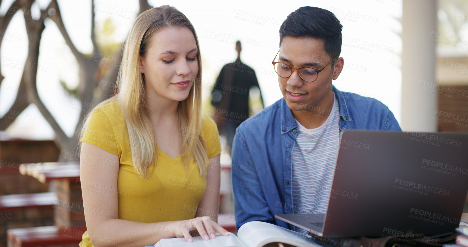 Buy stock photo Students, team and laptop with reading book outdoor for education, learning and assignment research. Study, man and woman prepare for exam with textbook for knowledge and partner on university campus