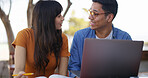 Laptop, textbook and students at university with studying for test, assignment or exam together. Computer, education and people talking for assessment with research for learning at college campus.