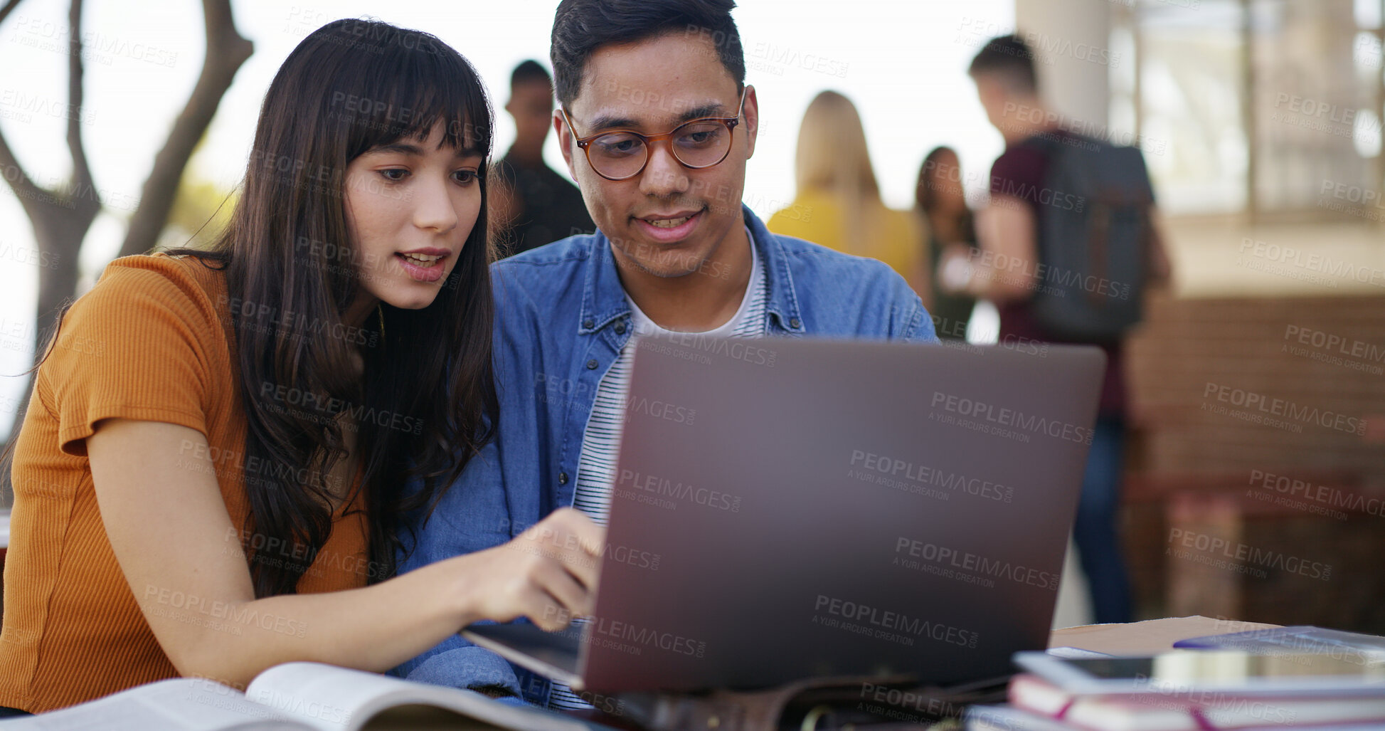 Buy stock photo Laptop, books and people at university with studying for test, assignment or exam together. Computer, education and students talking for assessment with research for learning at college campus.