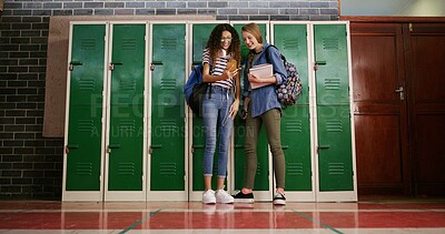 Buy stock photo Happy friends and locker with phone at high school for education, gossip news and funny message. Below, girl and students with mobile for learning, meme website and check test results for assessment
