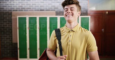Buy stock photo Student, boy and happy with backpack in high school for learning, education and ready for class. Scholarship, teenager and laugh in hallway for knowledge, academic development and study opportunity