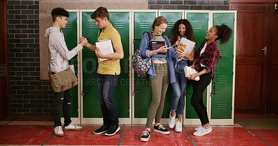 Buy stock photo Students, group and friends at high school for story, gossip or learning at recess. Education, happy people or teenagers in conversation on break by lockers with handshake, chat and laugh at campus