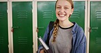 Books, smile and portrait of teenager in high school for education, scholarship and gcse classes. Gen z student, yearbook and project study with girl in hallway of campus for textbook assessment 