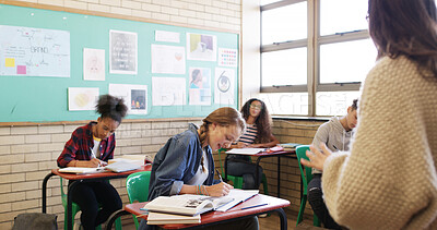 Buy stock photo High school, education and teacher with students in classroom for curriculum, lesson and learning. Academy, teaching and woman with teenagers for discussion, writing notes and listening for knowledge