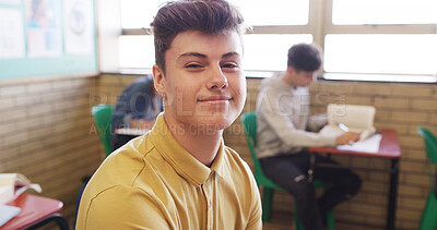 Buy stock photo Boy, portrait and class with happy student for education, learning or academic knowledge in school. Male person, teenager or learner with smile in classroom for personal growth or skill development
