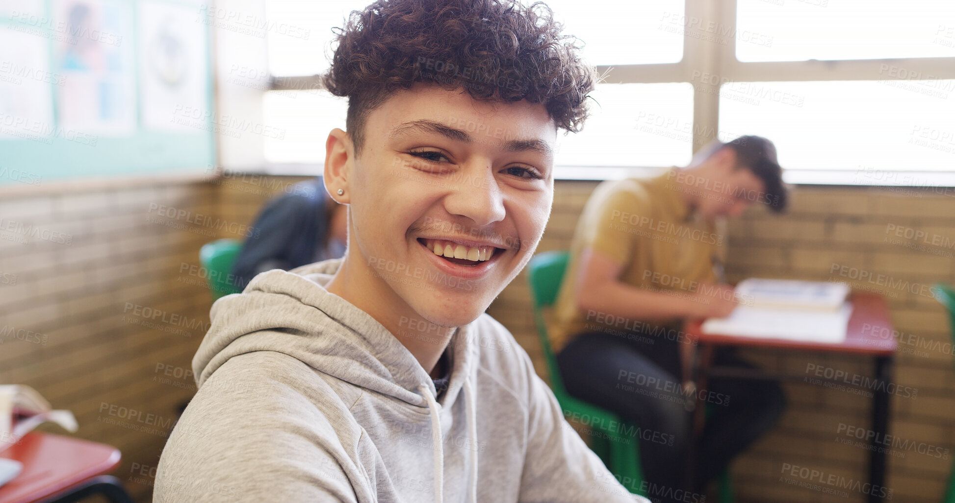 Buy stock photo Education, portrait and smile of boy in classroom of school for development, learning or study. Academics, growth and knowledge with happy teen student in class for course, information or lesson