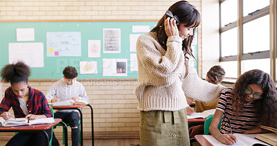 Buy stock photo High school, learning and teacher with student for help with test, assignment and exam question. Academy, classroom and woman with teenager writing assessment for education, lesson and development