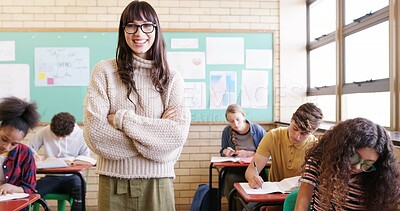 Buy stock photo Portrait, tutor and woman with arms crossed, classroom or pride for teaching children and education. Knowledge, teacher and person with smile in school, teens and writing exam for curriculum or learn