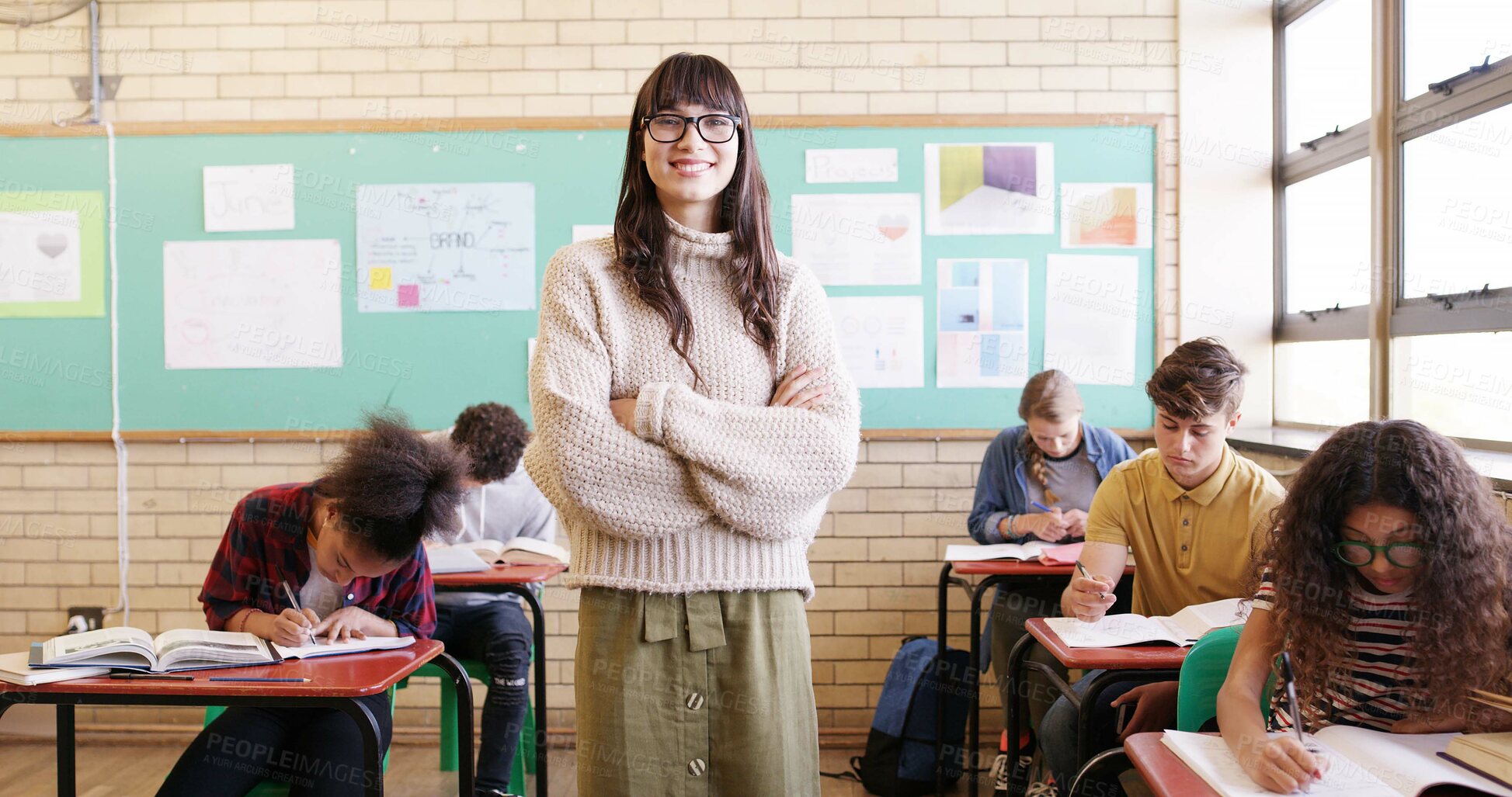 Buy stock photo Crossed arms, portrait and woman educator in classroom with confidence for education career. Smile, knowledge and female teacher with pride for job, growth or development at high school or academy.