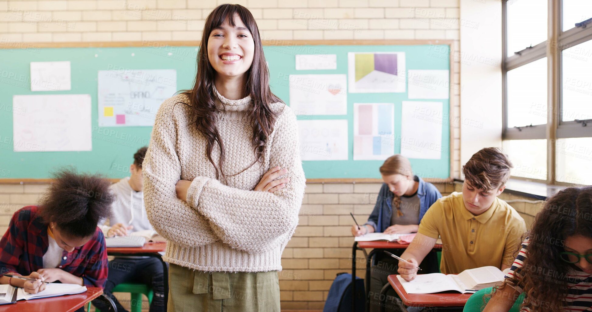 Buy stock photo Crossed arms, happy and woman educator in classroom with confidence for education career. Portrait, knowledge and female teacher with pride for job, growth or development at high school or academy.