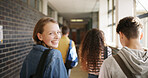 Happy girl, students or walking back to school in hallway or corridor for class schedule. Female person, friends or teenager with bag or smile for education, learning or development outside classroom