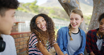 Buy stock photo High school, happy and students outdoor for talking, conversation and chat together on campus. Academy, teenagers and friends laughing for funny story, gossip and discussion at recess for education