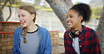High school, break and friends outdoor for talking, conversation and chat together on campus. Academy, teenagers and girls laughing for funny story, gossip and discussion at recess for education