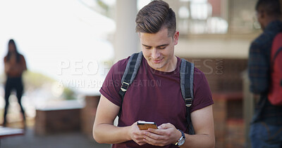 Buy stock photo Typing, university and man with phone on campus for social media, internet and networking at college. School, happy and student on smartphone for online chat, website and class schedule for learning