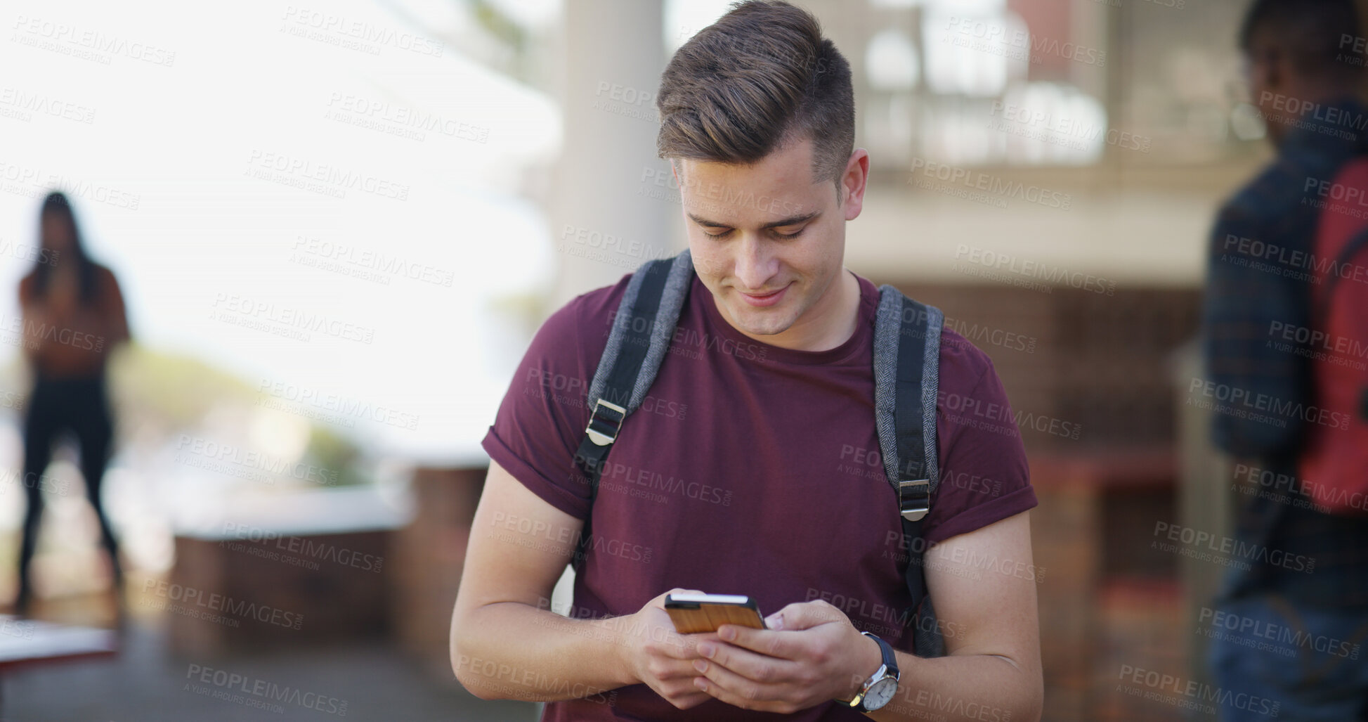 Buy stock photo Typing, university and man with phone on campus for social media, internet and networking at college. School, happy and student on smartphone for online chat, website and class schedule for learning
