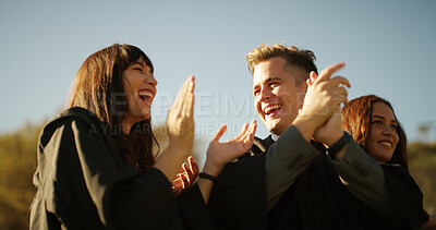 Buy stock photo Applause, education and graduation with people outdoor for celebration, milestone or success. Achievement, excited and scholarship with graduate students clapping on college on university campus