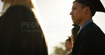 Buy stock photo Man, listen and students at graduation ceremony for education, celebration and class success. Group, people and waiting outdoor for degree, college achievement and award announcement of learning goal