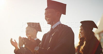 Buy stock photo Clapping, excited and graduation with students outdoor for celebration, milestone or success. Achievement, applause and education with graduate people on college on university campus for scholarship