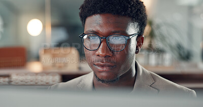 Buy stock photo Reading, black man and night in office with accountant, financial manager and idea with bokeh. Reflection, glasses and business person with computer, overtime research and administration agency