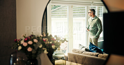 Buy stock photo Phone, thinking and man by window in home for view in morning with memory, reflection or networking. Cellphone, ideas and mature male person by glass door in living room at apartment on weekend.