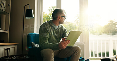 Buy stock photo Home, thinking and man with tablet, window and creativity with online news, relax and choice. Ideas, tech and mature person with view, lens flare and decision with research for article and solution