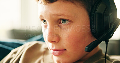Buy stock photo Headphones, home and boy with video game, relax and competition with esports, fun and hobby. Apartment, headset and child on sofa, contest and playing with break, recreation and subscription