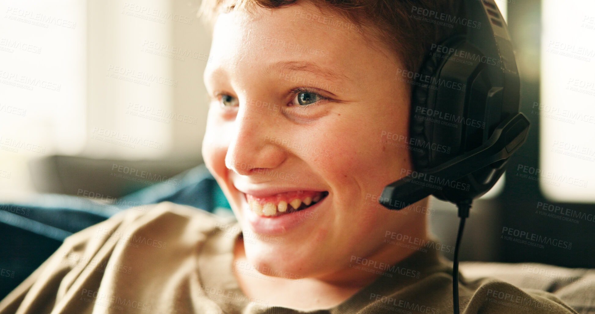 Buy stock photo Headphones, home and boy with smile, video game and competition with esports, relax and hobby. Apartment, headset and happy child on sofa, contest and playing with fun, recreation and subscription