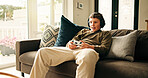 Home, video game and boy with controller, child and entertainment with subscription. Challenge, kid and gamer on couch, online contest or audio with esports, click and relax with hobby or headphones