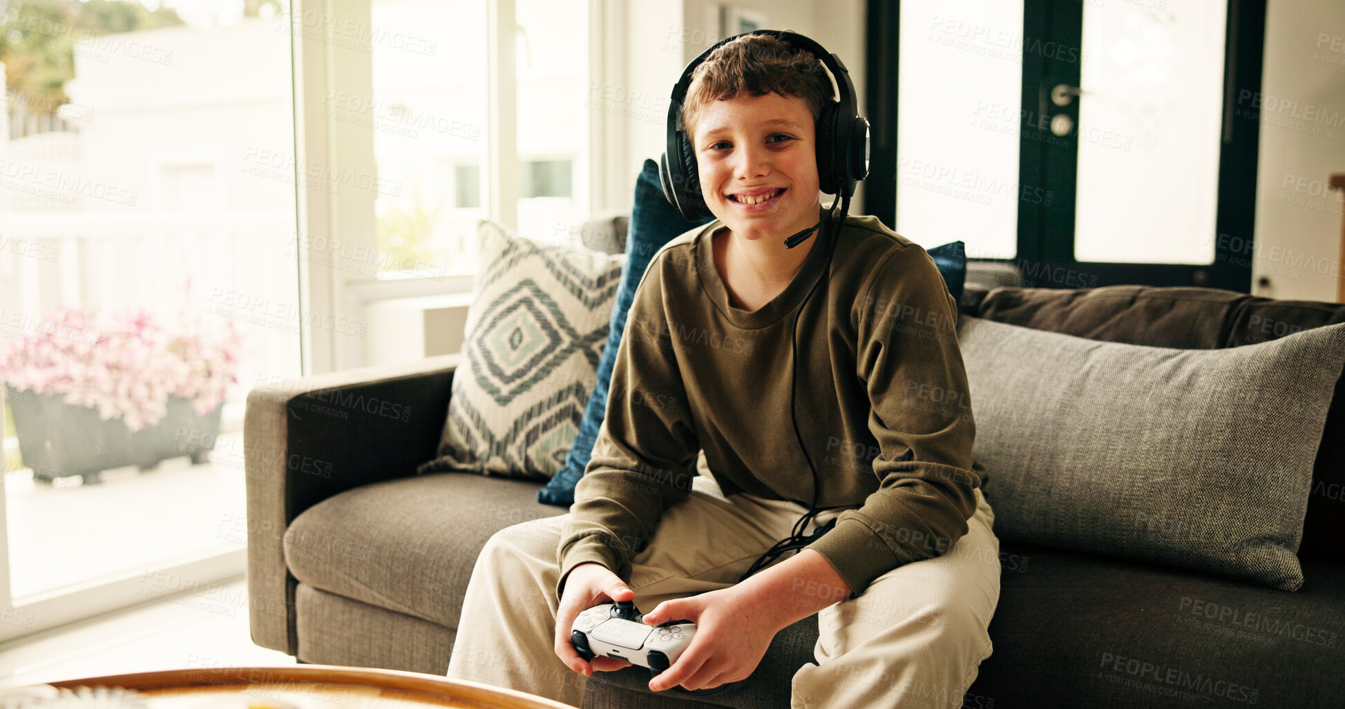 Buy stock photo Portrait, video game and boy with controller, kid and entertainment with challenge. Home, headphones and child on sofa, online contest or sound with esports, click or smile with hobby or subscription